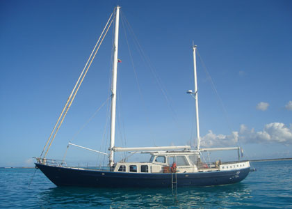 A click on this picture will bring you to the general information page of this website, the page which is called SPECIFICATIONS. This page will show you the specs of this sailing yacht monsoon, a vessel with a great reputation. Maybe the only sailing yacht in the world that has been twice visiting Easter island, rapa nui easter island the navel of the world with moai's moai stone statue rapa nui easter island the navel of the world with moai's moai stone statue sailing yacht monsoon is for sale and for charter in caribbean. This strong steel pilothouse motorsailer is a good buy to go cruising around the world with her good sailing hull and reliable diesel engine. She is the best ocean sailing cruising yacht for sale now. Buy this sailboat and go cruising, follow your obsession, climb the main mast check out the island and beach. That is why you buy a yacht, first thing you look for sailboat or sailing yacht for sale, than you go sailing, if all is best, make a good deal, stop dreaming about a world cruising ocean adventure. Do it, go cruising around the world, go wind surfing kite surfing, visit beaches with boat girls on a sailing vacation. caribbean, cuba with this big yacht or superyacht it's ok. Go again looking for Moai statues on Easter island,  a sailing yacht for sale, the ketch sailing yacht for sale is low budget cruising and you find wanted crew wanted, because a boat is a dream coming true. sailing yacht for sale, sailing yacht going to venezuela aruba curacao bonaire like monsoon sailing yacht for sale, going around the world. what about islas las aves islas los roques islas los testigos, good diving snorkeling in this adventurous southern caribbean with isla tortuga isla margarita abc islands and their constant trade winds. do a charter, come sailing on this sailing yacht for sale and for charter. Buy sailing yacht for sale , steel ketch for sale , new teak decks, worldwide cruising in comfort and safety, this pilothouse motorsailer is a dream , a wonderful yacht sailing under power.